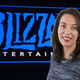 Jennifer Oneal in front of a Blizzard logo.
